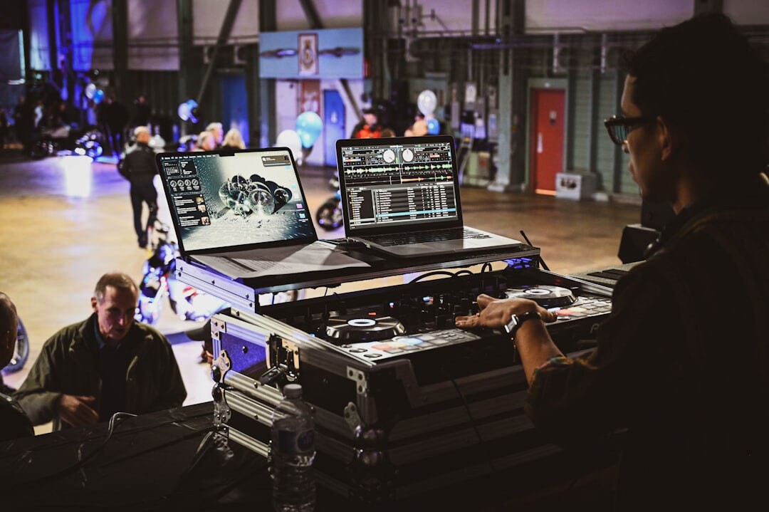 Team working on live broadcast workflow coordination with computers and monitors