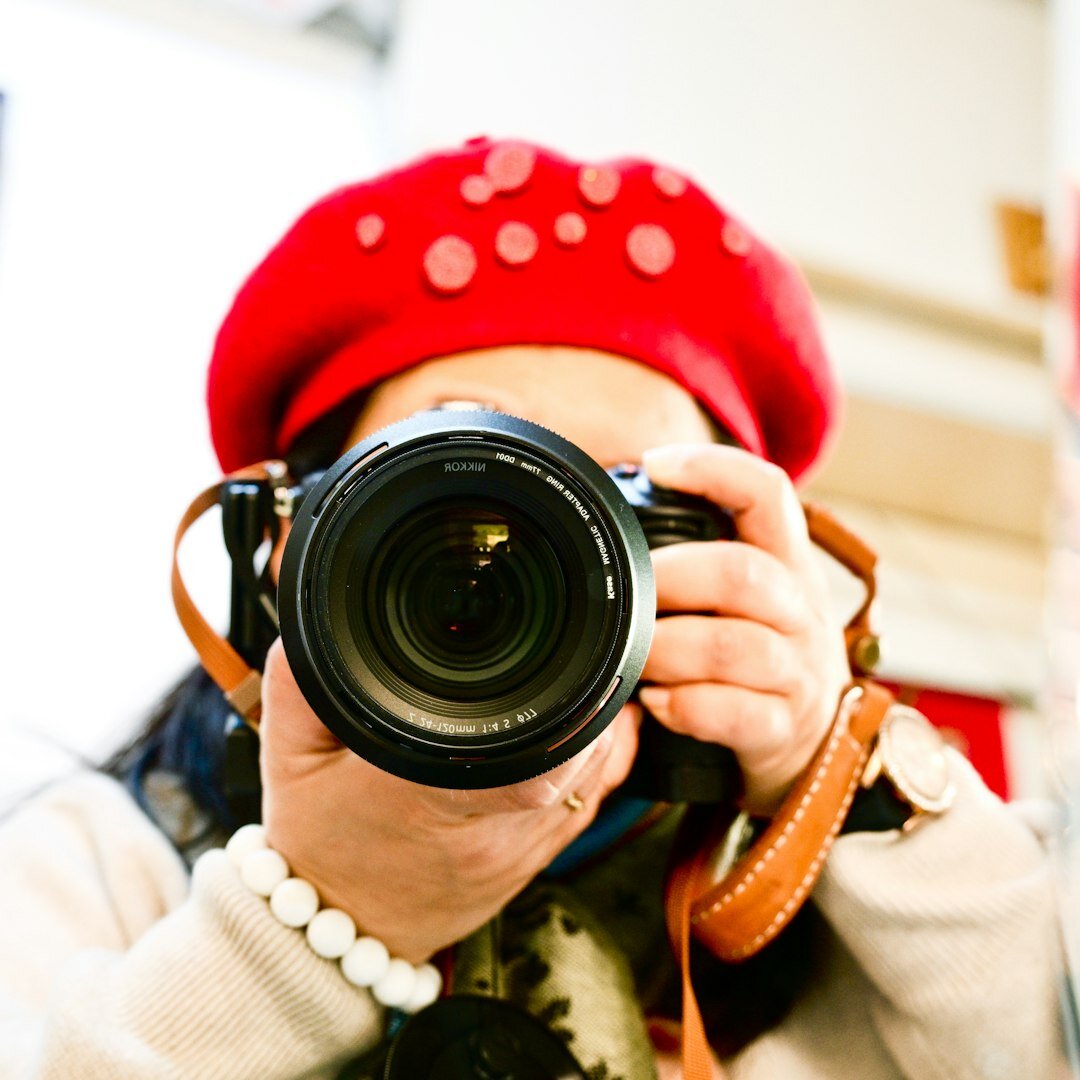 Camila Oliveira, Camera Coordinator, professional Brazilian woman in business attire