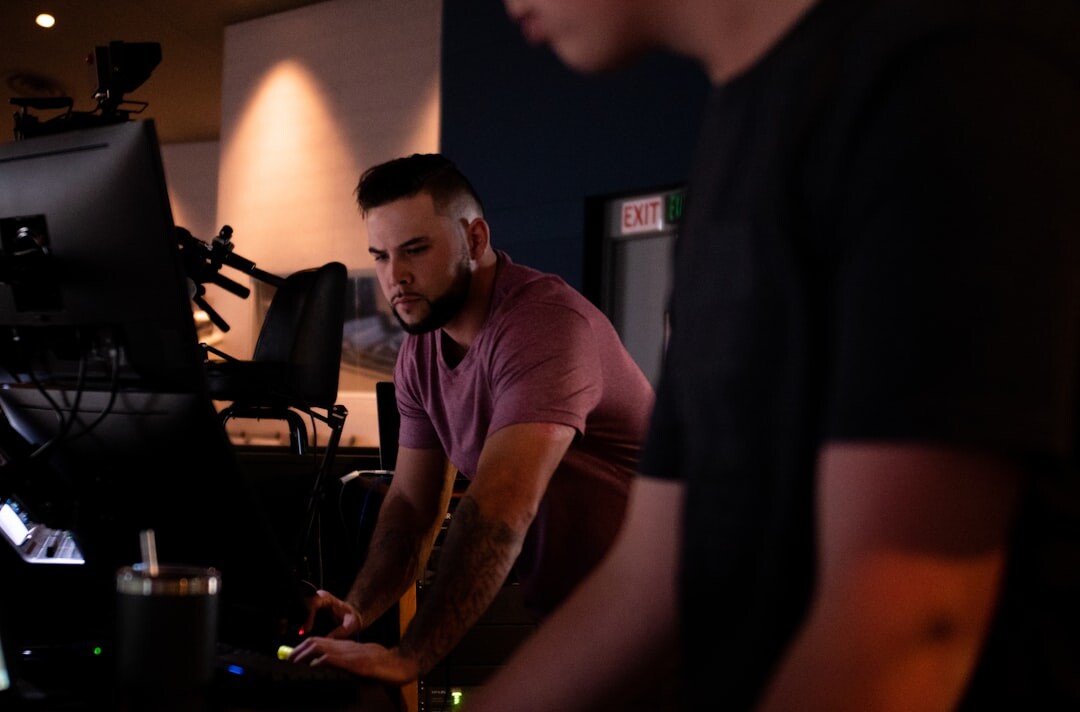 Wide shot of a professional broadcast production studio with team working together