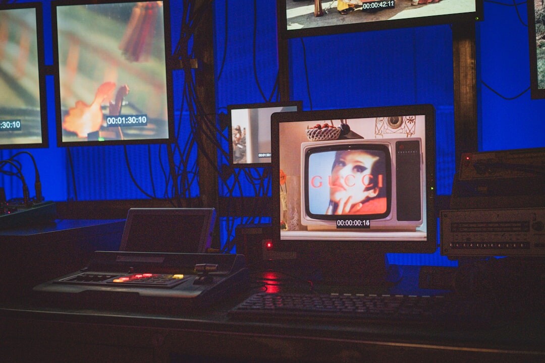 Live broadcast radio and television studio with presenter and production team at work