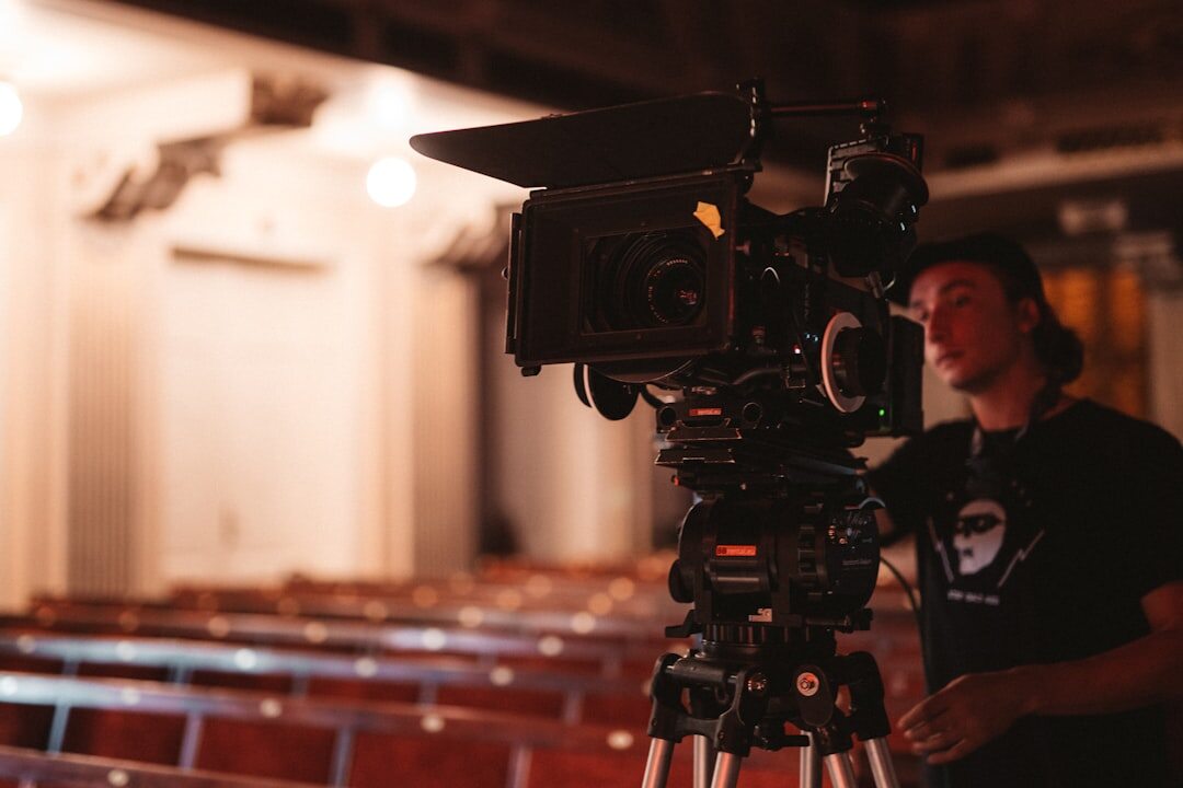 Professional camera operator filming a live broadcast event