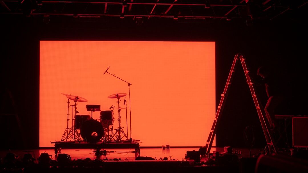 Dramatic live concert broadcast with stage lights and cameras